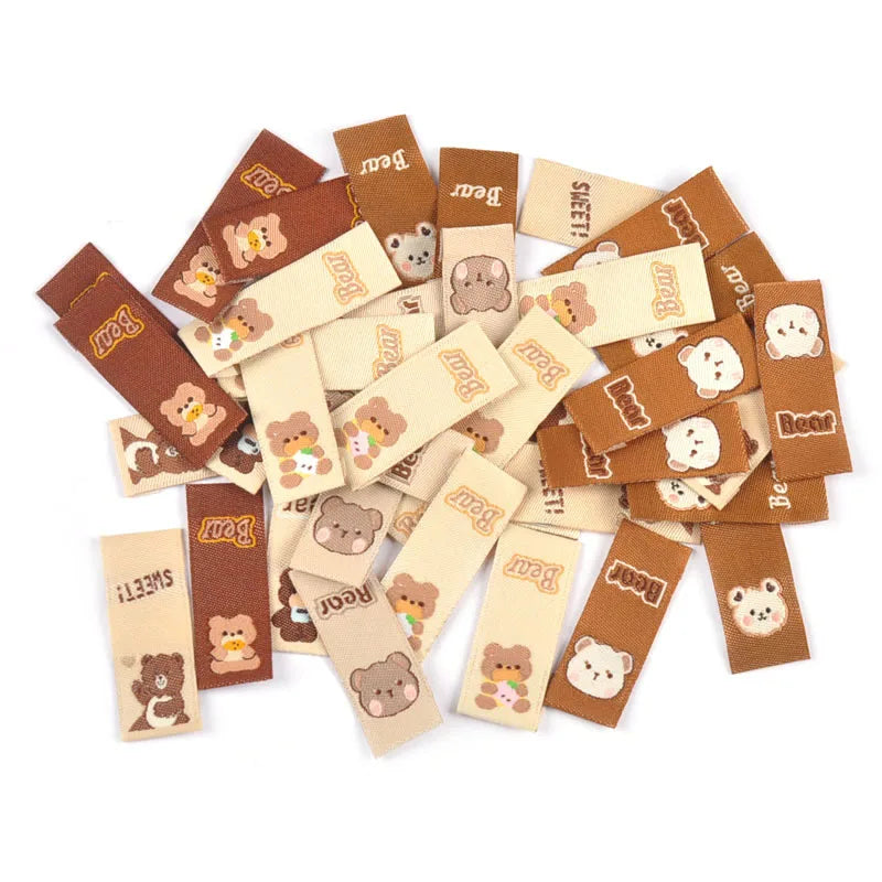 50Pcs Lovely Brown Bear Embroidery Labels For Sewing Accessories Bags Clothes Washable Care Tags Kids Garment Handmade DIY c3205 Qme