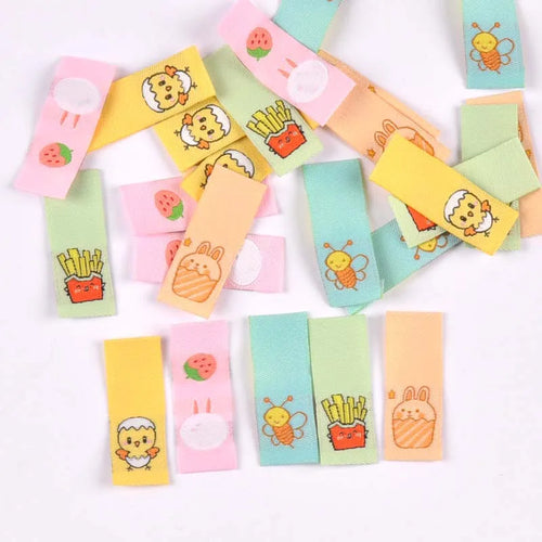 50Pcs 1.5x4cm Multicolor cute cartoon embroidery Clothes Labels For Sewing Accessories Garment Care Bags Tags Handmade Crafts Qme