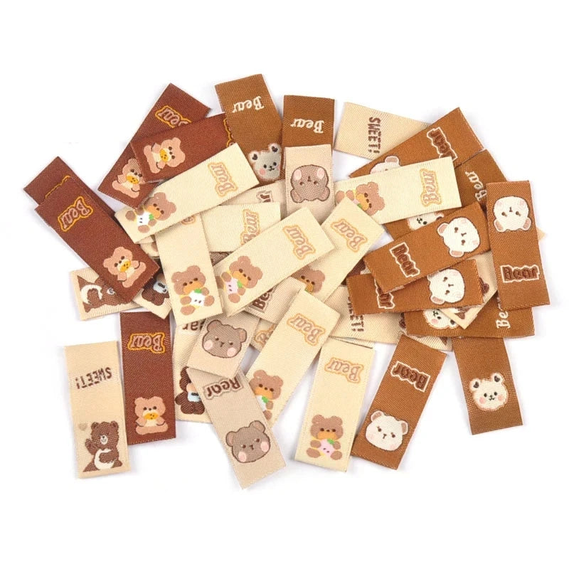 50Pcs Lovely Brown Bear Embroidery Labels For Sewing Accessories Bags Clothes Washable Care Tags Kids Garment Handmade DIY c3205 Qme mix