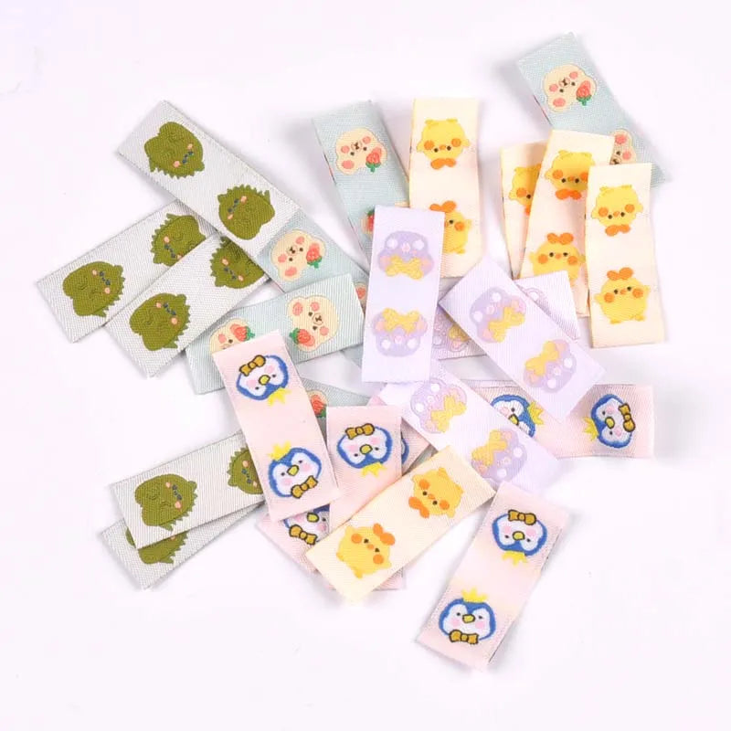 50Pcs Cartoon Dinosaur/Penguin Labels For Shoes Care Bags Sewing Garment Handmade Accessories DIY Crafts Fabric Clothing Tags Qme random mixed