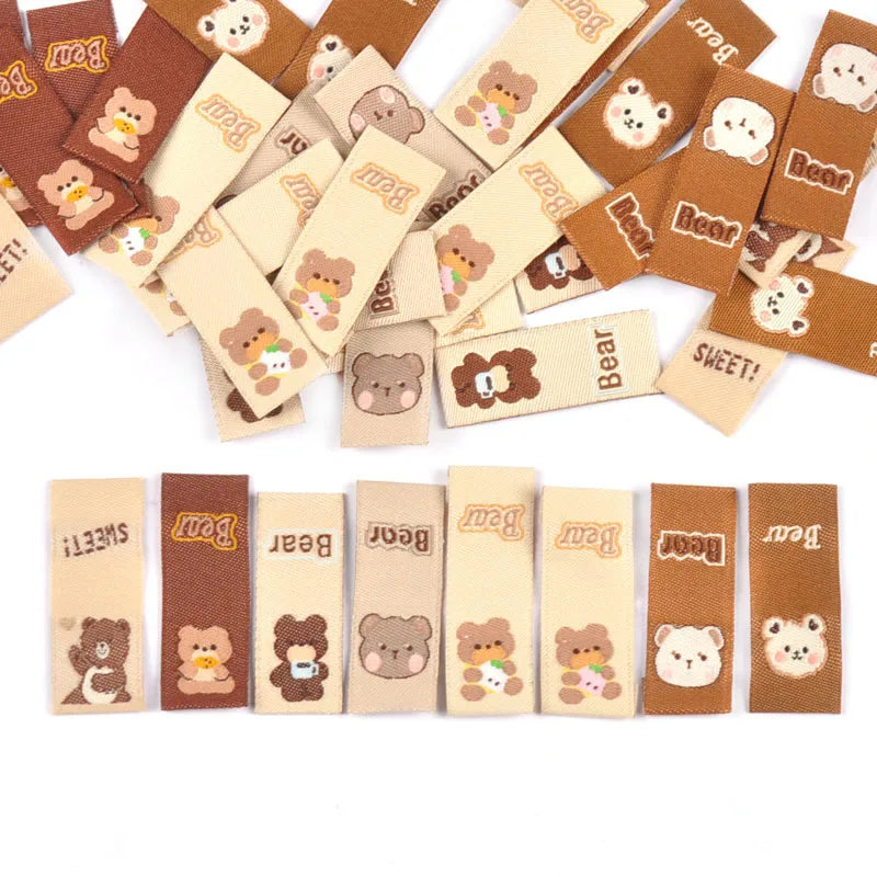 50Pcs Lovely Brown Bear Embroidery Labels For Sewing Accessories Bags Clothes Washable Care Tags Kids Garment Handmade DIY c3205 Qme