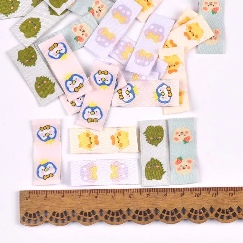 50Pcs Cartoon Dinosaur/Penguin Labels For Shoes Care Bags Sewing Garment Handmade Accessories DIY Crafts Fabric Clothing Tags Qme