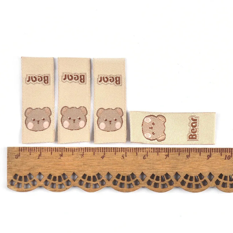 50Pcs Lovely Brown Bear Embroidery Labels For Sewing Accessories Bags Clothes Washable Care Tags Kids Garment Handmade DIY c3205 Qme 3