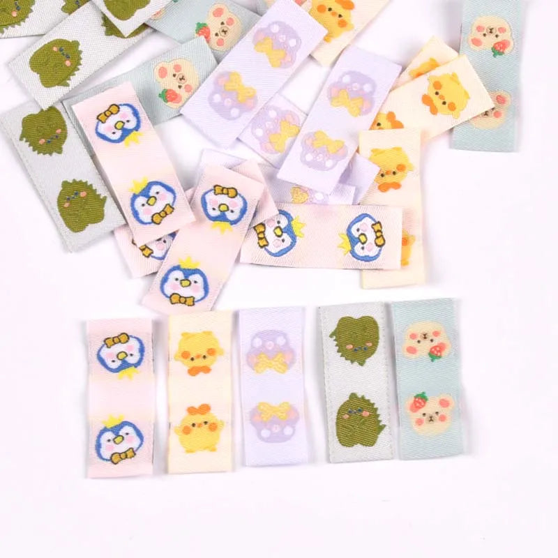 50Pcs Cartoon Dinosaur/Penguin Labels For Shoes Care Bags Sewing Garment Handmade Accessories DIY Crafts Fabric Clothing Tags Qme
