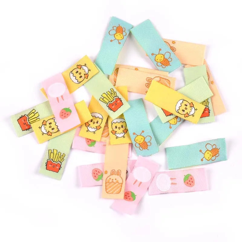 50Pcs 1.5x4cm Multicolor cute cartoon embroidery Clothes Labels For Sewing Accessories Garment Care Bags Tags Handmade Crafts Qme random mixed