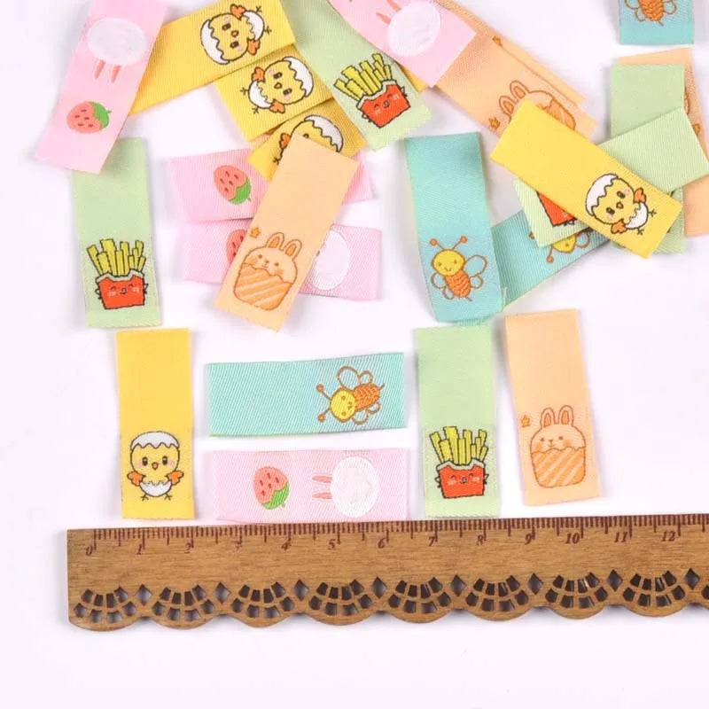 50Pcs 1.5x4cm Multicolor cute cartoon embroidery Clothes Labels For Sewing Accessories Garment Care Bags Tags Handmade Crafts Qme