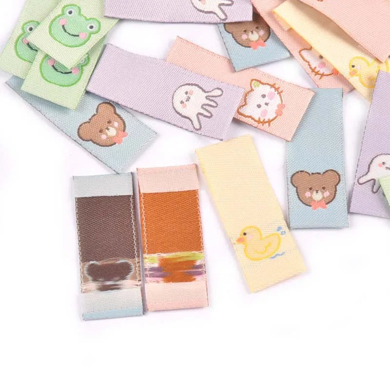 50Pcs Cat/Bear/Octopus/Frog/Duck Embroidery Washable Labels For Sewing Accessories Care Bags Clothes Tag Handmade Crafts c3161 Qme