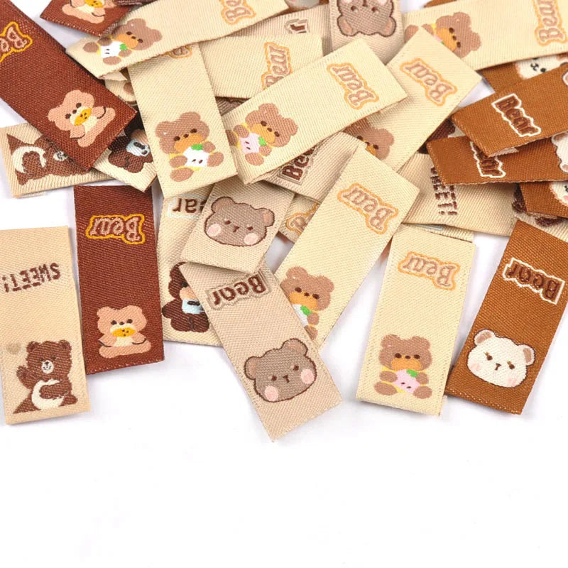 50Pcs Lovely Brown Bear Embroidery Labels For Sewing Accessories Bags Clothes Washable Care Tags Kids Garment Handmade DIY c3205 Qme