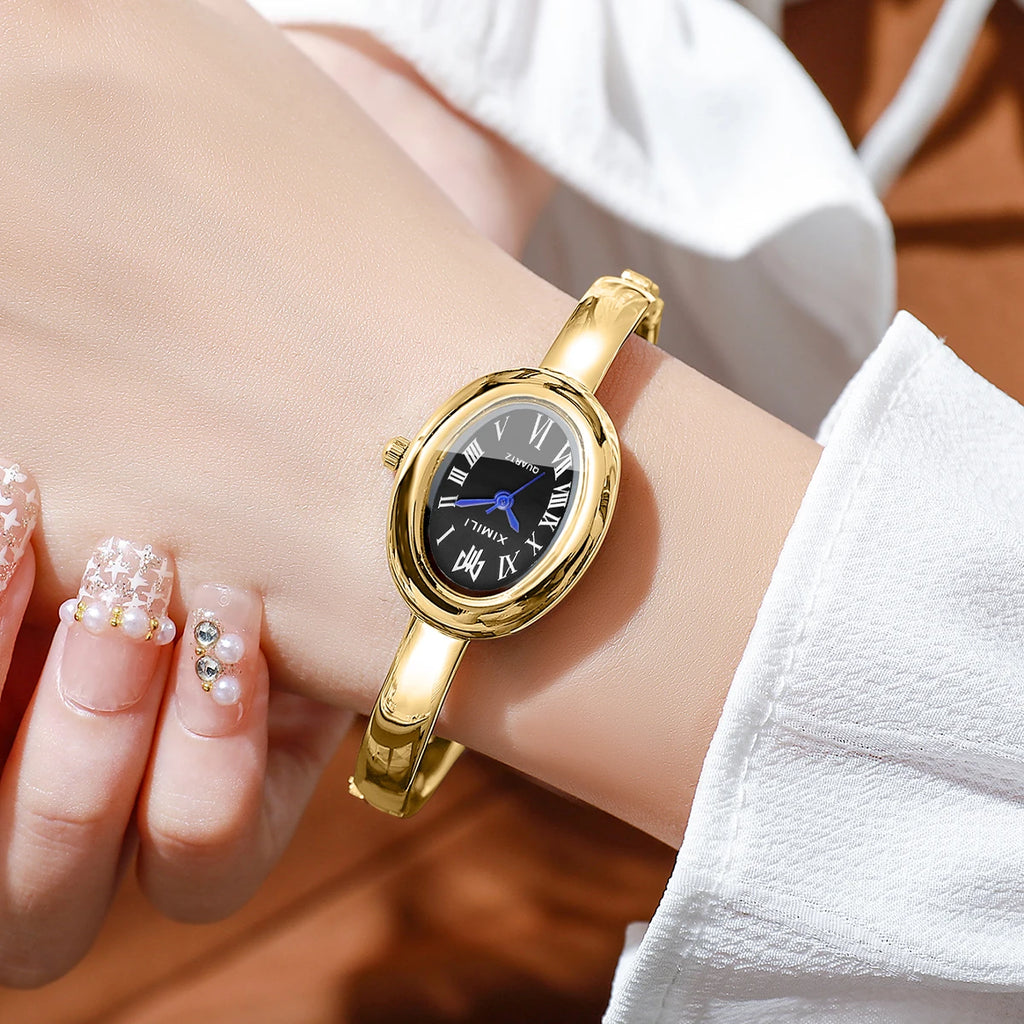 Diamond studded bathtub bracelet women's watch women's watch fashion oval Roman scale women's watch quartz watch Qme