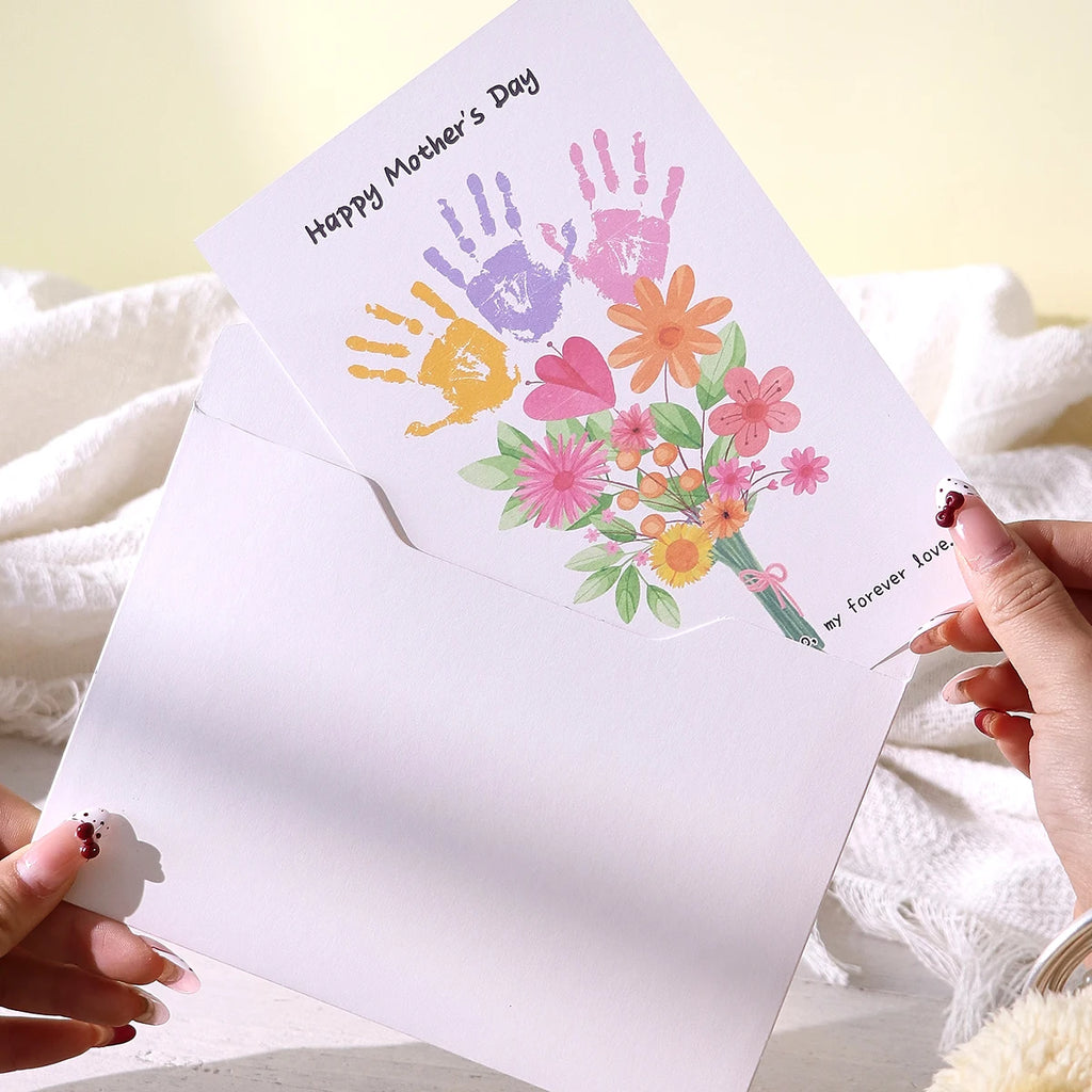 A Mother's Day Greeting Card with an Accompanying Envelope. The Card Is Blank and Features a Cartoon Floral Design, Suitable for Mother's Day Celebrations, as a Thank You Card, or as a Mother's Day Gift for Mom. Qme