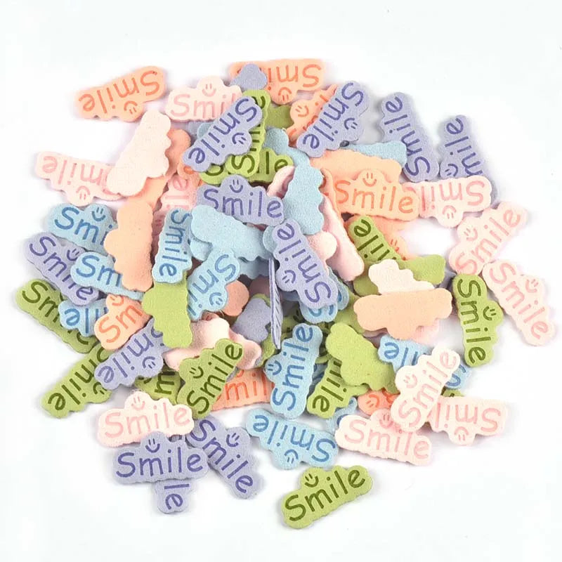 30pcs 14.5x29mm Smile Letter Embossed Leather Labels For Clothes Sewing Accessories DIY Bag Kid Garment Craft Handmade Tag C3707 Qme
