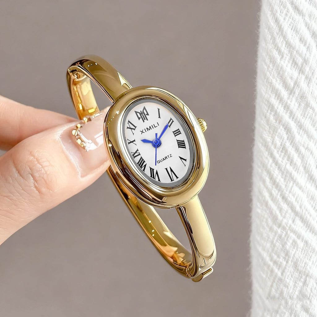 Diamond studded bathtub bracelet women's watch women's watch fashion oval Roman scale women's watch quartz watch Qme