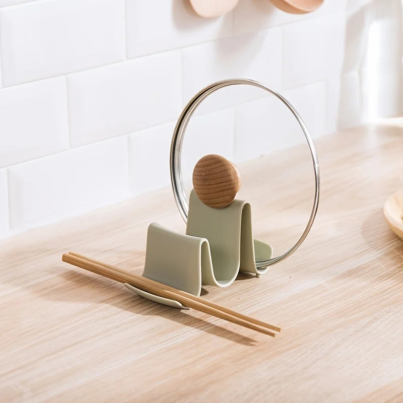 A wavy kitchen countertop, lid, spatula, storage rack, and storage rack Qme