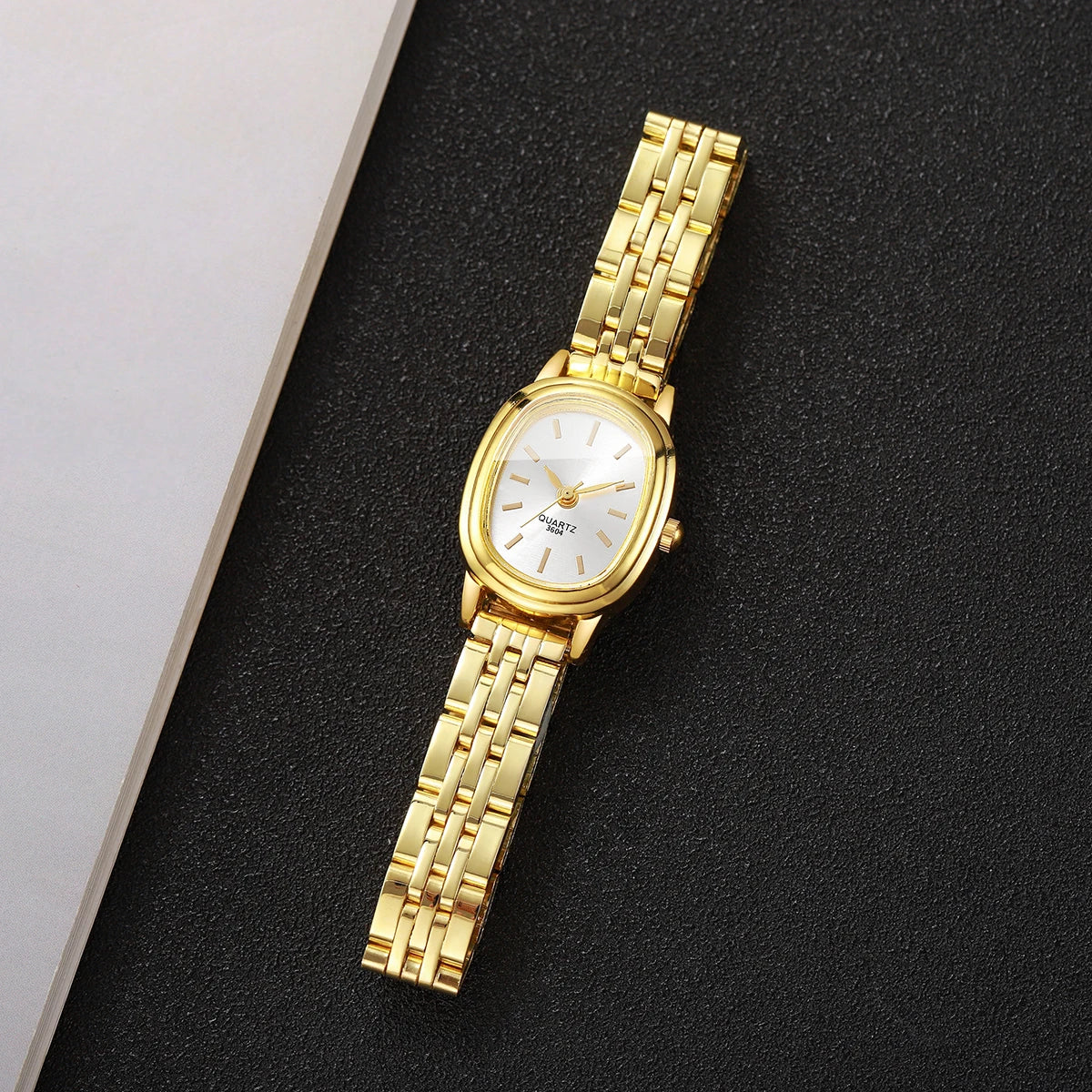 Golden oval thin steel strip women's simple strip scale retro small watch, no gift box included Qme