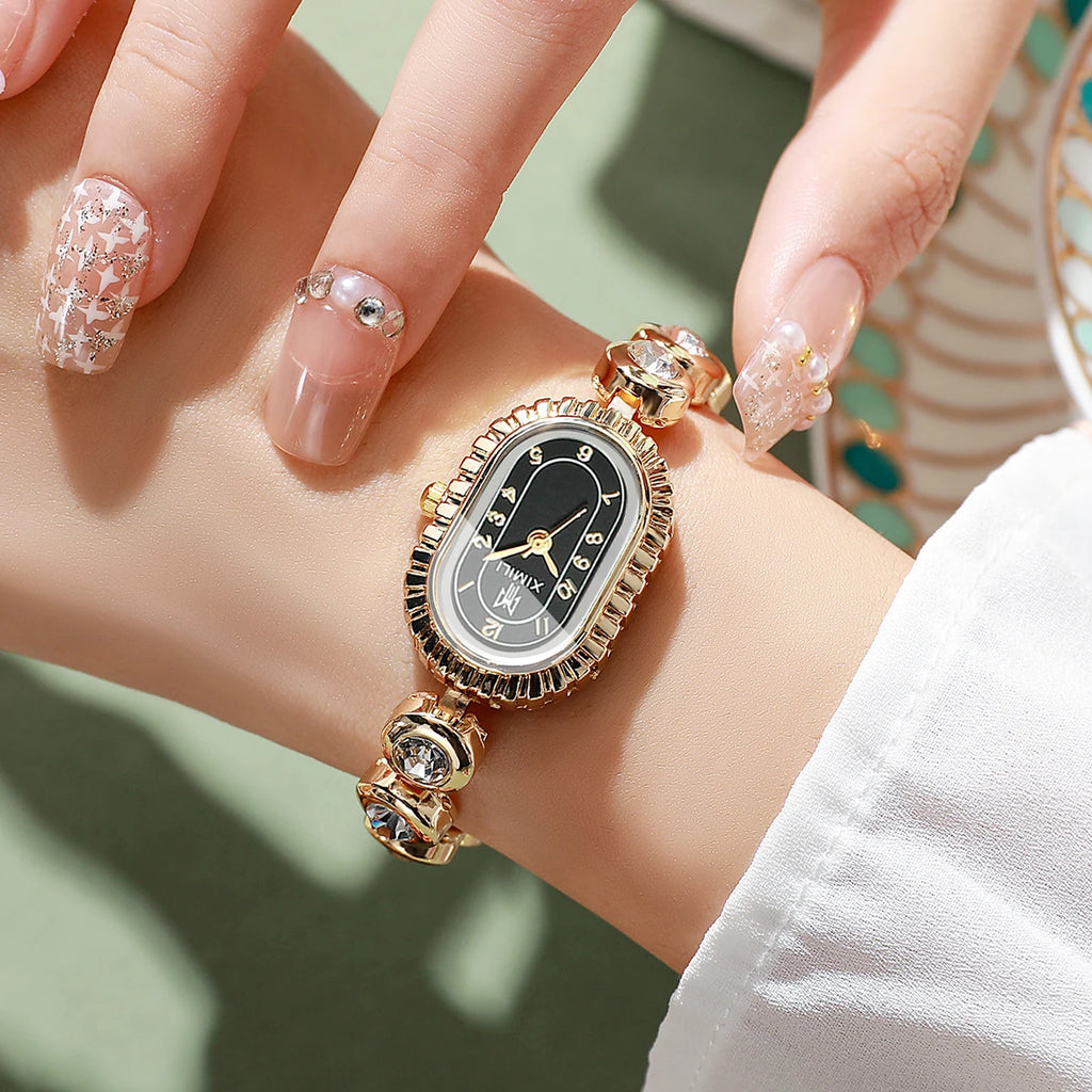 Women's Luxury Crystal Quartz Watch, Oval Black Dial with Diamond Bezel and Gold Tone Band, Casual/Office Wear Qme