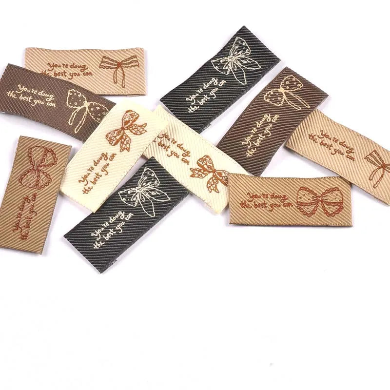 30pcs 44x20mm White/Black/Coffee Knitted Bow Label DIY Sewing Crafts Clothes for Headwear/Clothing/Shoes/Bags cp3841 Qme