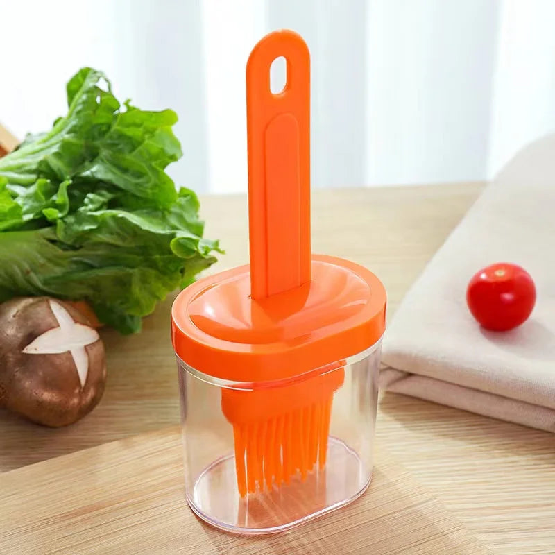 A silicone oil brush with bottle for kitchen baking and grilling Qme Orange