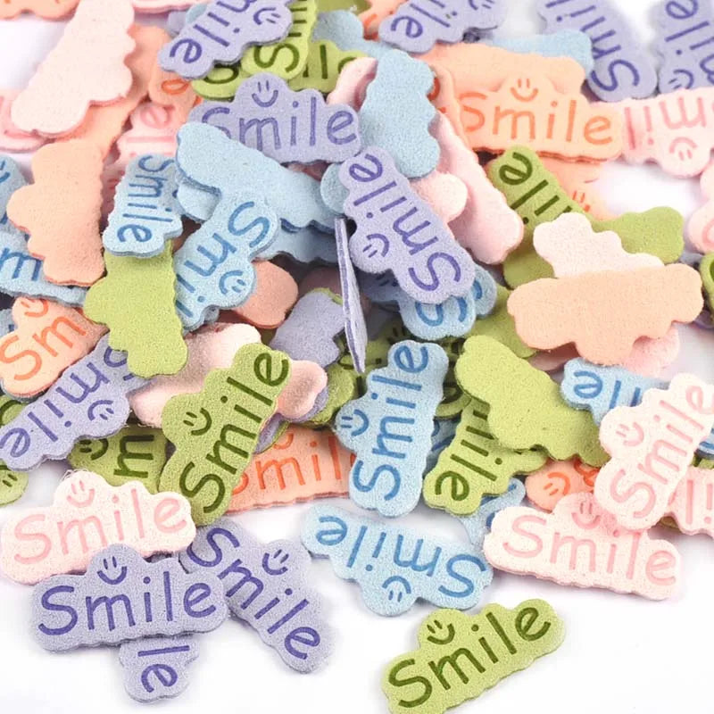30pcs 14.5x29mm Smile Letter Embossed Leather Labels For Clothes Sewing Accessories DIY Bag Kid Garment Craft Handmade Tag C3707 Qme random mixed