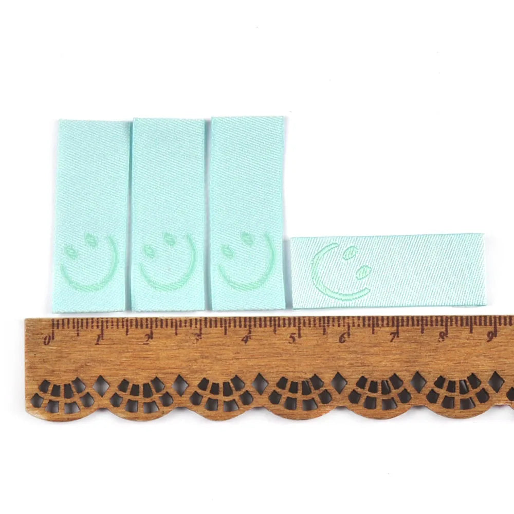 50Pcs New Candy Color Embroidery Smile Labels For Sewing Accessories Clothes Washable Care Garment Bags Tags DIY Supplies c3513 Qme 1