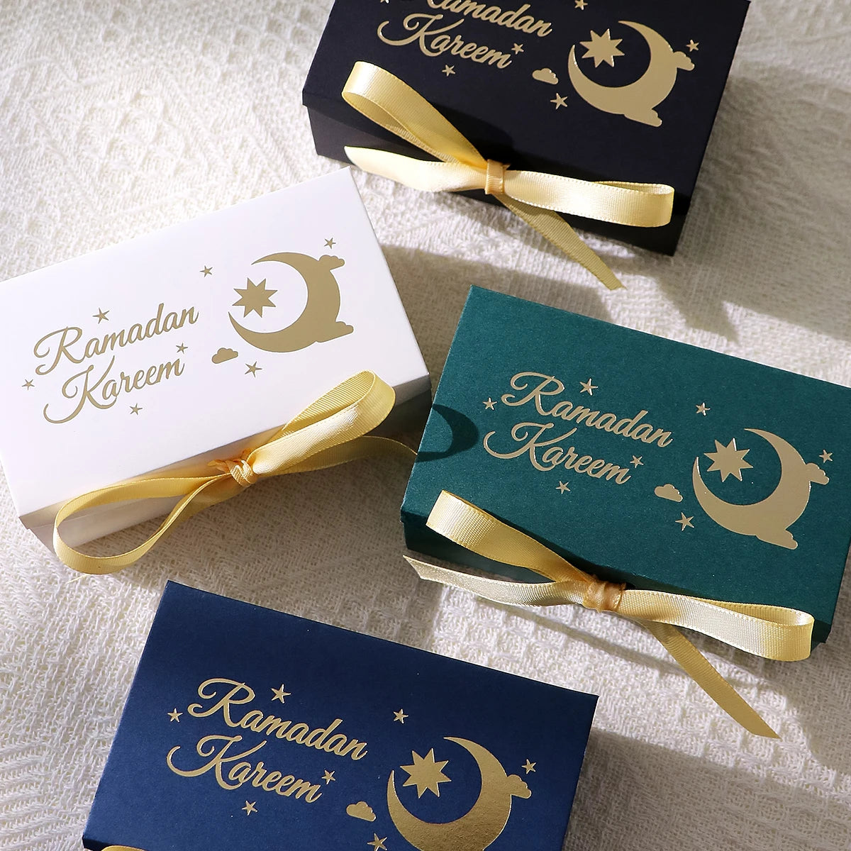10 Rectangular Multi-Colored Gift Boxes with Gold Crescent and Planet Designs Printed on Them, Specifically Designed for Ramadan, and Adorned with Gold Ribbons — Perfect for Packaging Homemade Sweets, Premium Dates, and Sma Qme