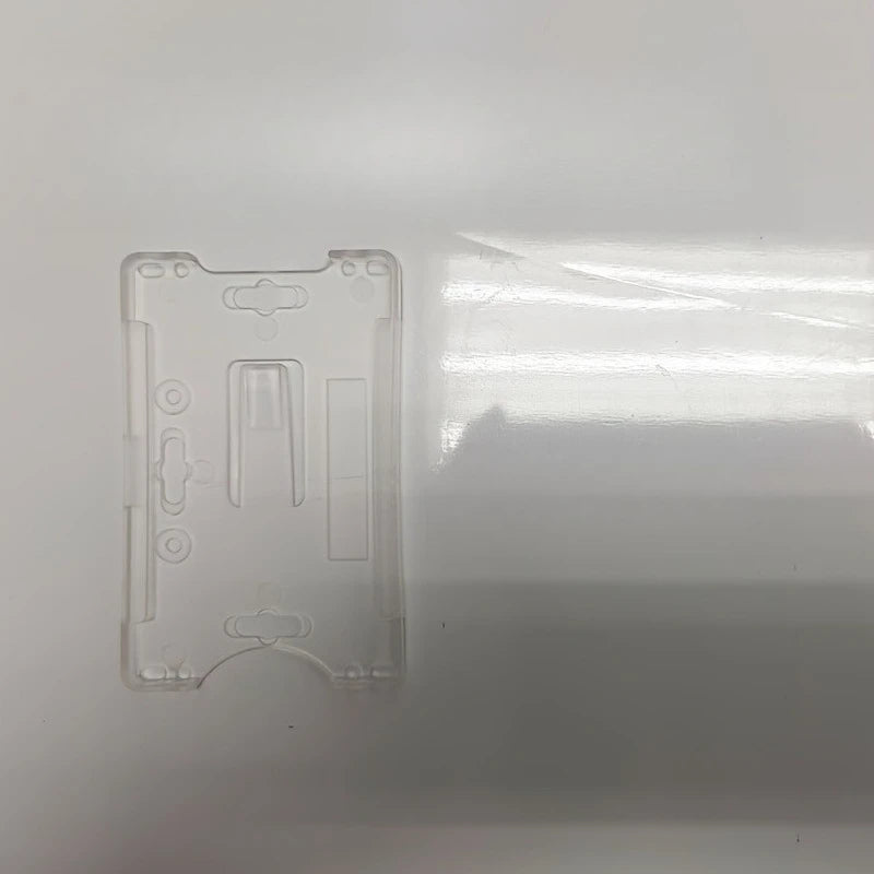 Windshield parking card holder, facilitating the operation of the safety door and the retrieval of identification cards. Qme
