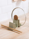A wavy kitchen countertop, lid, spatula, storage rack, and storage rack Qme green