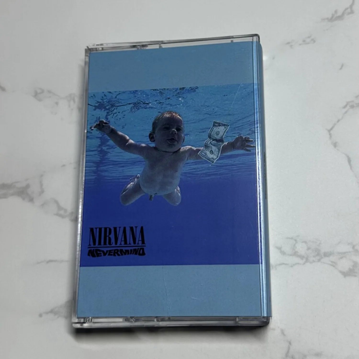 Vintage Rock Themed Cassette Tape, Blue Pool Art Cover, Retro Analog Audio Media for Music Fans & Vintage Collectors Qme Nevermind