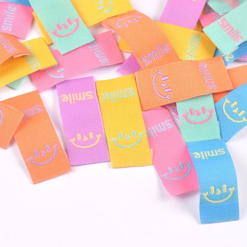 50Pcs Colorful Smile Embroidery Colth Labels Garment Washable Care Tags Sewing Accessories Crafts DIY Knitting Bag Shoe Supplies Qme