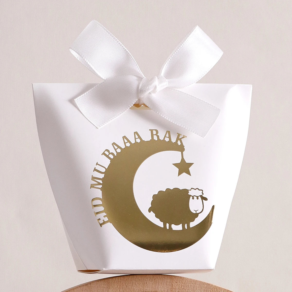 10 Elegant Black, White, and Green Eid Al-Adha Gift Boxes, Decorated with Creative Golden Crescent Lanterns and Lamb Motifs Perfect for Holding Candies, Chocolates, and Small Gifts. It Is a Celebration of the Eid Al-Adha. Qme