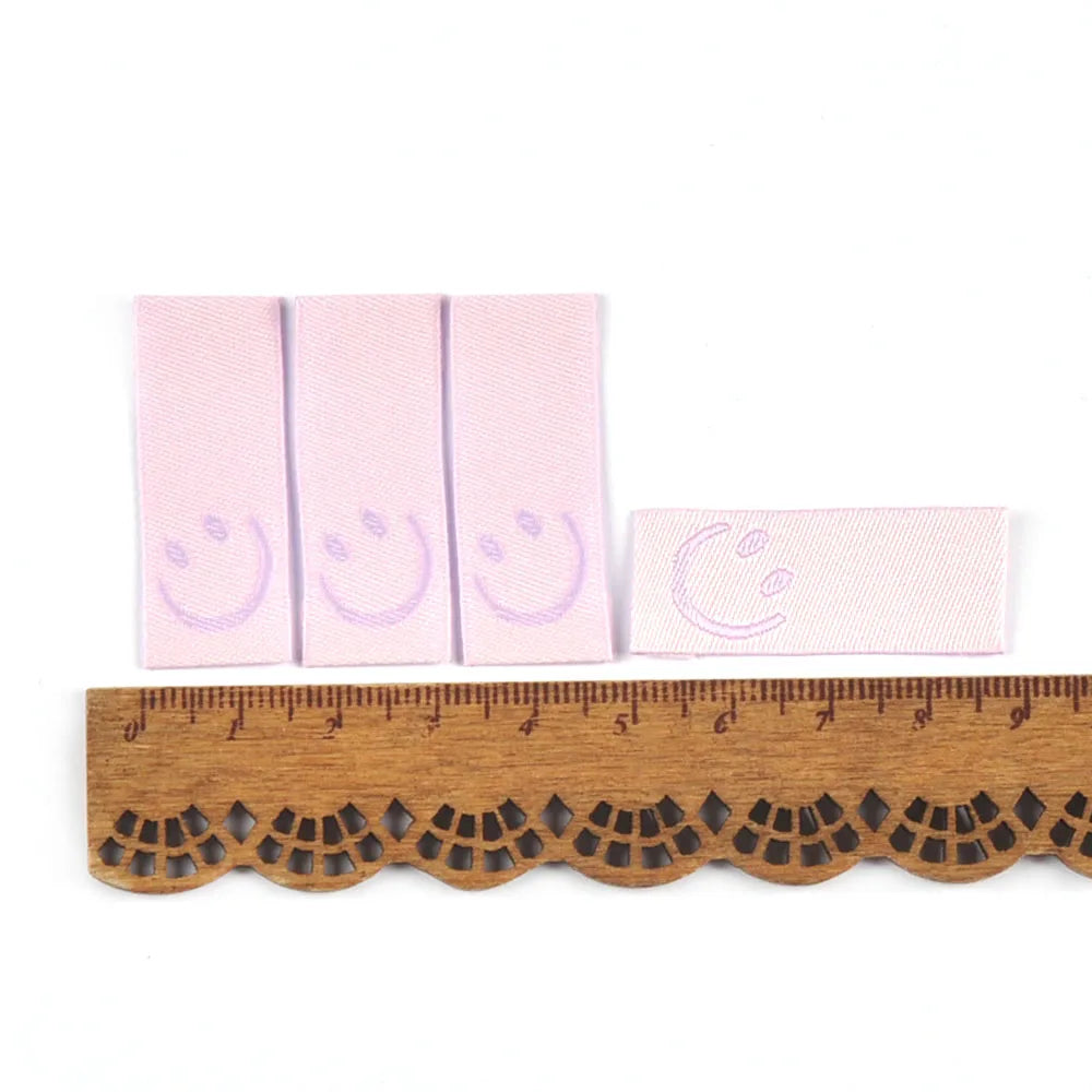 50Pcs New Candy Color Embroidery Smile Labels For Sewing Accessories Clothes Washable Care Garment Bags Tags DIY Supplies c3513 Qme 2