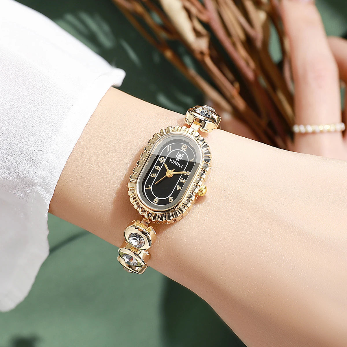 Women's Luxury Crystal Quartz Watch, Oval Black Dial with Diamond Bezel and Gold Tone Band, Casual/Office Wear Qme