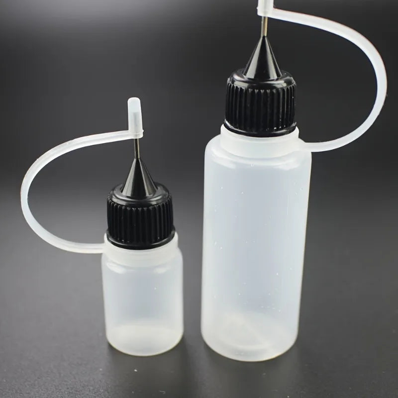 Plastic squeezable bottles, dropper bottles, ink bottles, glue bottles, dispensers, colored bottles, squeeze-fill bottles Qme