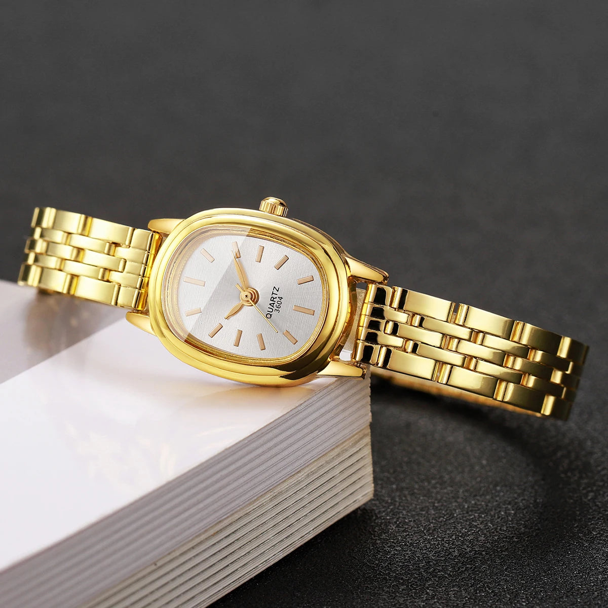 Golden oval thin steel strip women's simple strip scale retro small watch, no gift box included Qme