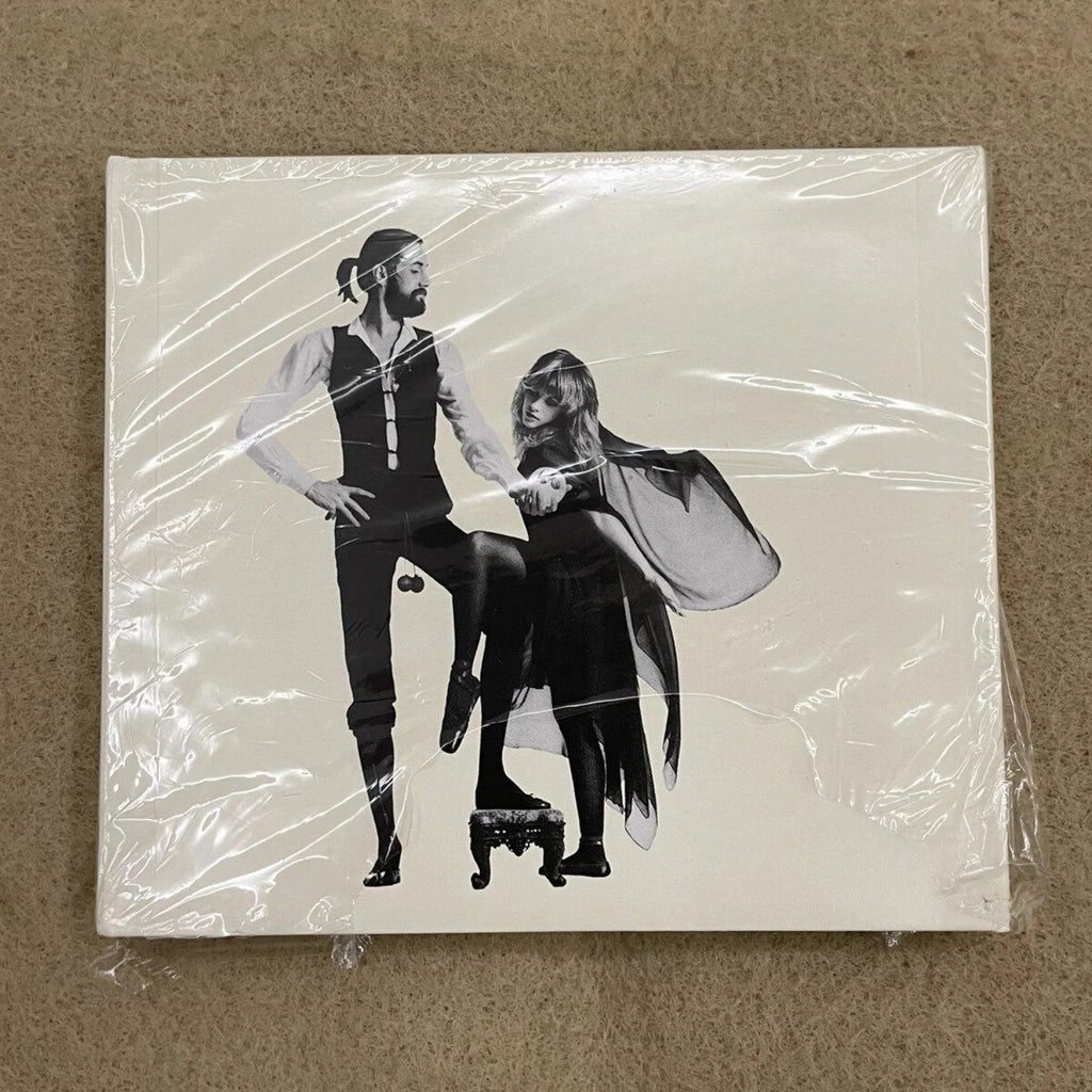 Rock Music CD Album with Retro Black-and-White Couple Silhouette Cover Elegant Design & Classic Tracks Creating A Nostalgic Vibe Qme Rumours