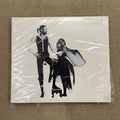 Rock Music CD Album with Retro Black-and-White Couple Silhouette Cover Elegant Design & Classic Tracks Creating A Nostalgic Vibe Qme Rumours