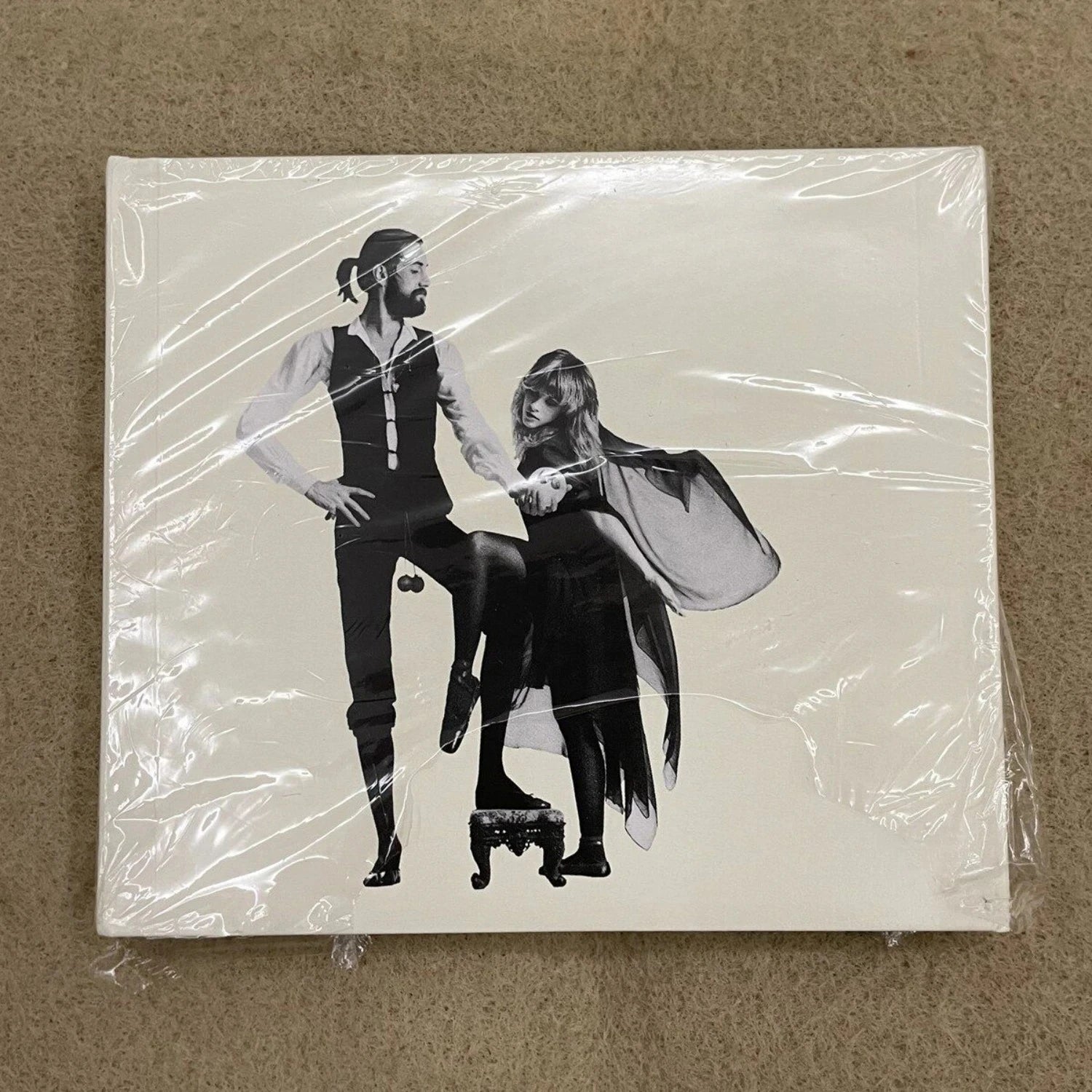 Rock Music CD Album with Retro Black-and-White Couple Silhouette Cover Elegant Design & Classic Tracks Creating A Nostalgic Vibe Qme Rumours