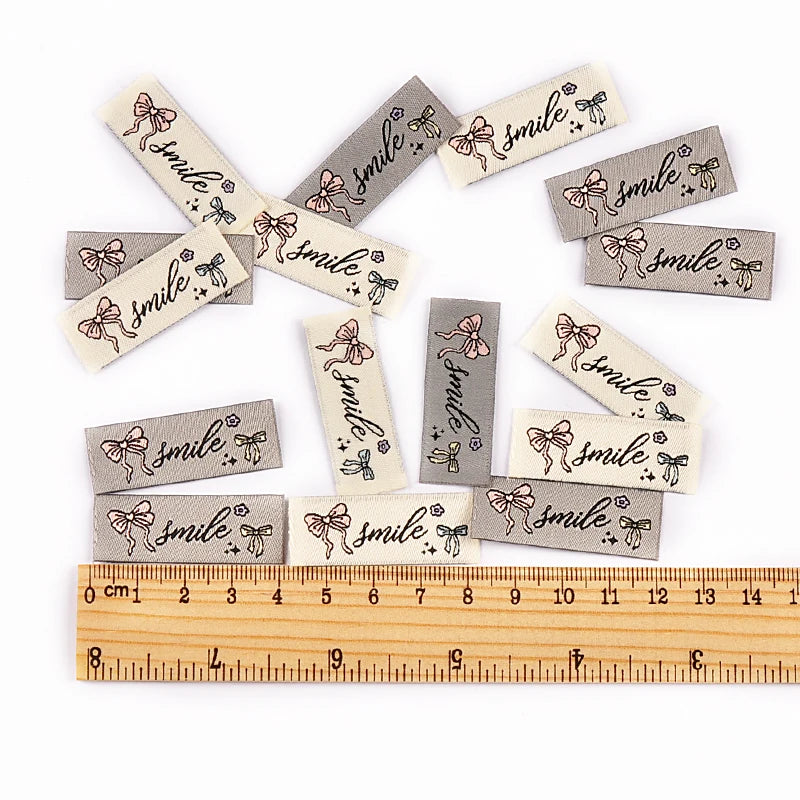 50pcs 15x40mm bowknot Rectangular Embroidery Label For Clothing Bag Decoration Accessories DIY Handmade Sewing Supplies cp4180 Qme 50pcs cp4180-mix
