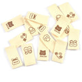 50pcs/lot 20x40mm Lovely Bear/Flower/Rabbit Printed Beige Label For DIY Decor Clothing Sewing Accessories Handmade Crafts c4146 Qme random mix