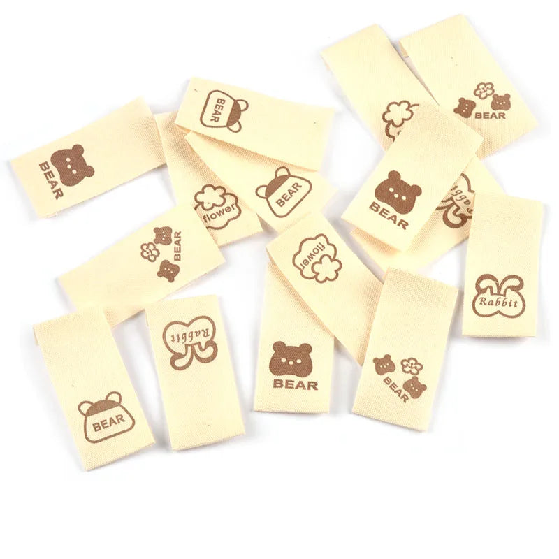 50pcs/lot 20x40mm Lovely Bear/Flower/Rabbit Printed Beige Label For DIY Decor Clothing Sewing Accessories Handmade Crafts c4146 Qme random mix