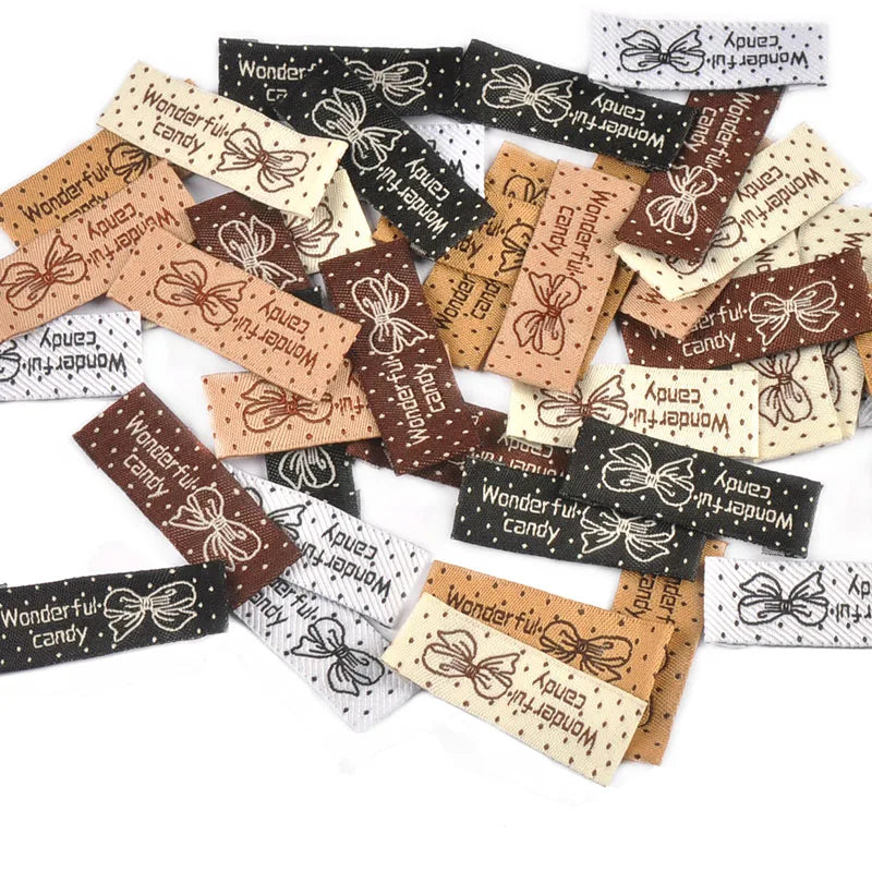 50pcs 41x15mm Mixed 6 Colors Rectangle Bow Dot Pattern Clothes Labels Sewing Supplies DIY Bags Shoes Hats Handmade Fabric c3783 Qme