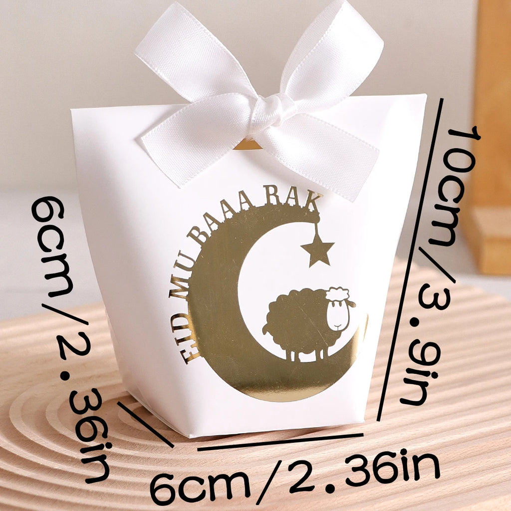 10 Elegant Black, White, and Green Eid Al-Adha Gift Boxes, Decorated with Creative Golden Crescent Lanterns and Lamb Motifs Perfect for Holding Candies, Chocolates, and Small Gifts. It Is a Celebration of the Eid Al-Adha. Qme