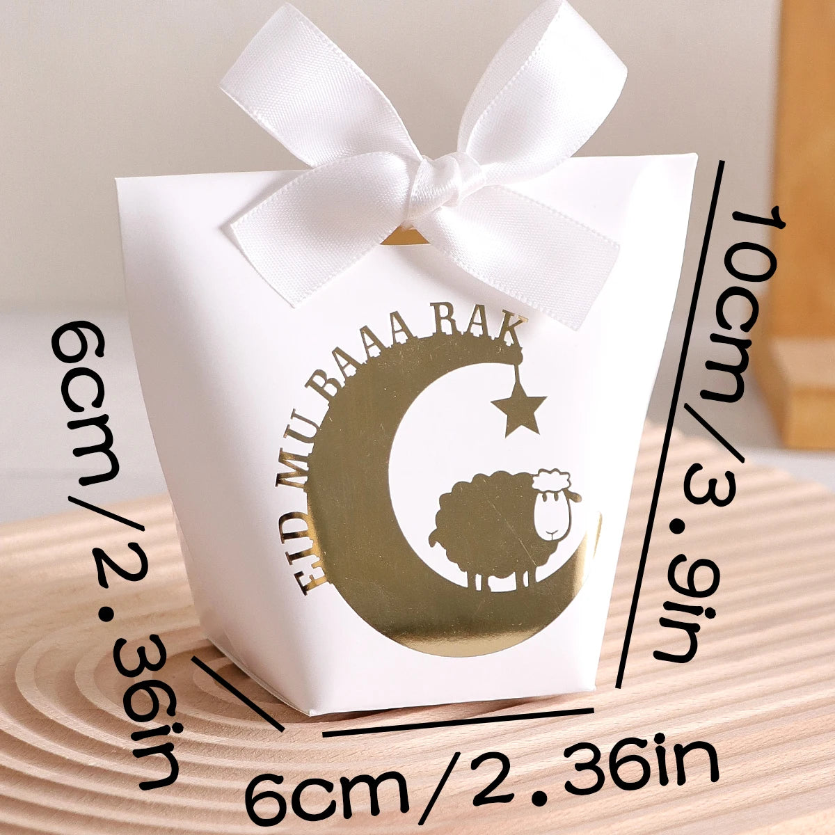 10 Elegant Black, White, and Green Eid Al-Adha Gift Boxes, Decorated with Creative Golden Crescent Lanterns and Lamb Motifs Perfect for Holding Candies, Chocolates, and Small Gifts. It Is a Celebration of the Eid Al-Adha. Qme
