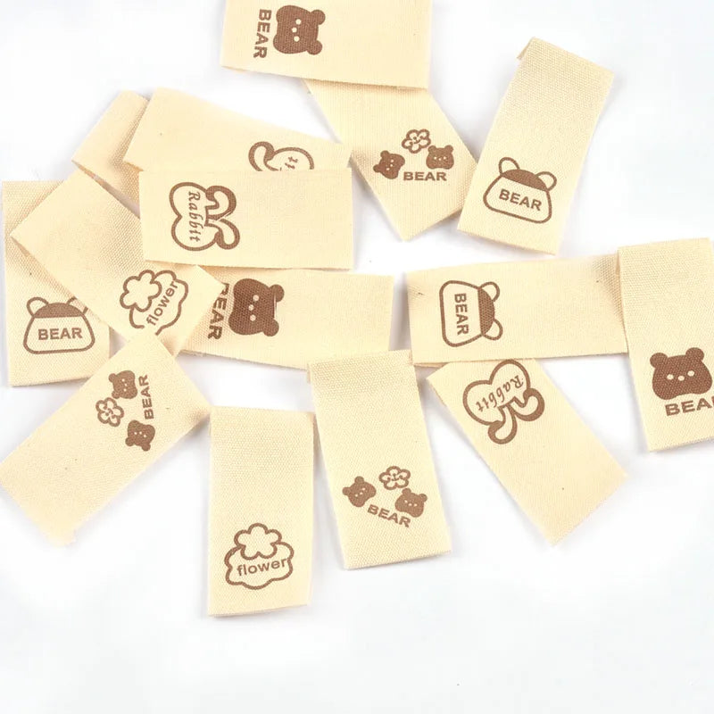50pcs/lot 20x40mm Lovely Bear/Flower/Rabbit Printed Beige Label For DIY Decor Clothing Sewing Accessories Handmade Crafts c4146 Qme