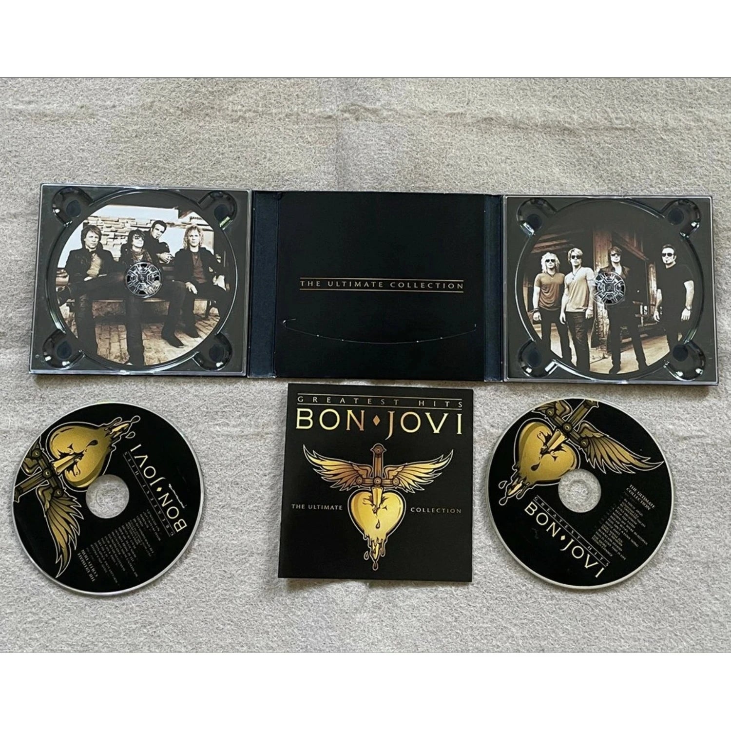 Rock Music CD Album with Bold Black & Gold Art Cover, Eye-Catching Sword-Heart-Wings Logo + High-Energy Rock TracksC Qme