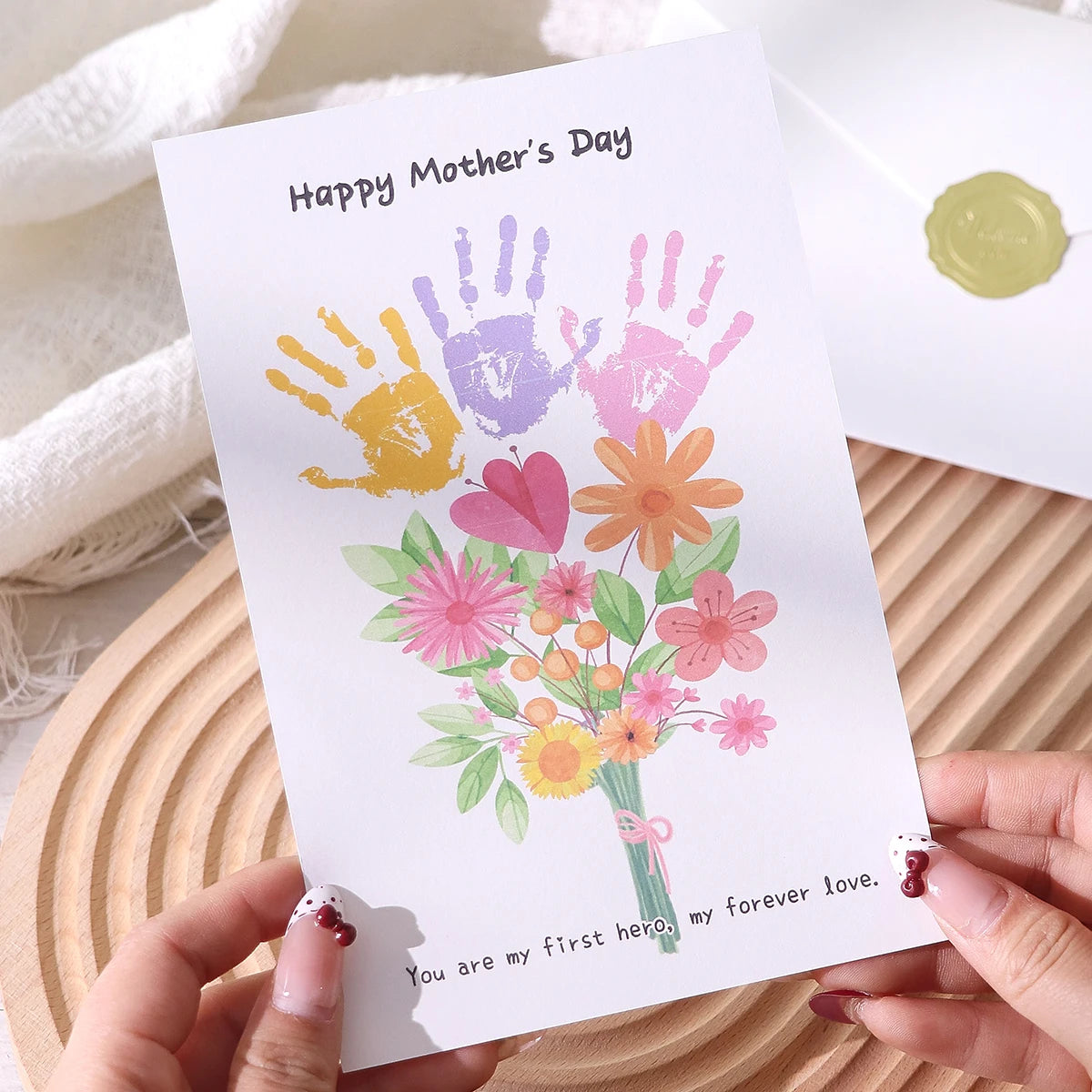 A Mother's Day Greeting Card with an Accompanying Envelope. The Card Is Blank and Features a Cartoon Floral Design, Suitable for Mother's Day Celebrations, as a Thank You Card, or as a Mother's Day Gift for Mom. Qme