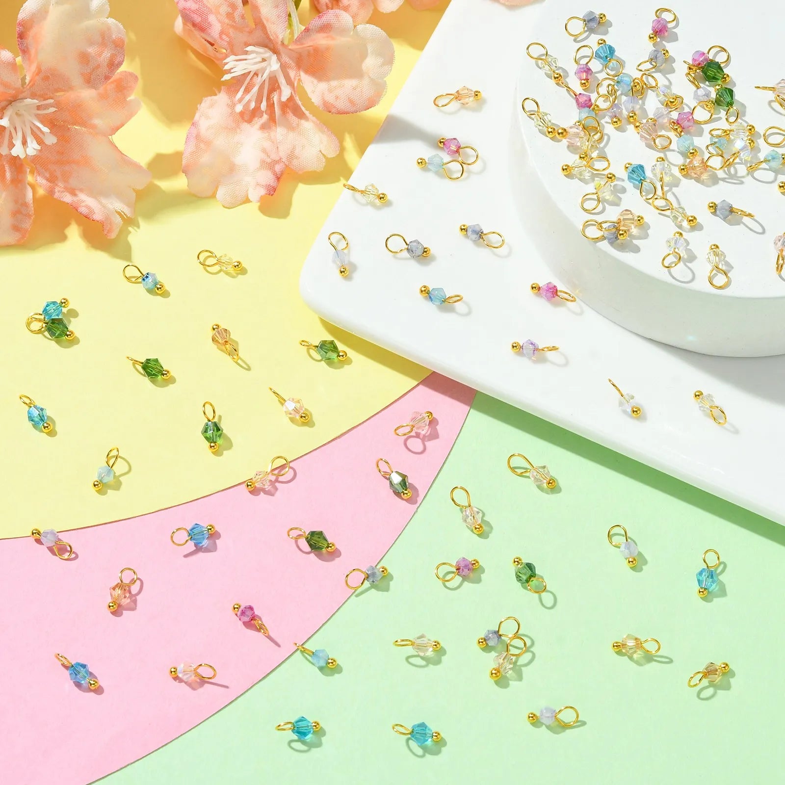 Pandahall 100Pcs Random Color Transparent Faceted Glass Charms Bicone Crystal Dangle Charms for DIY Necklace Bracelet Making Qme