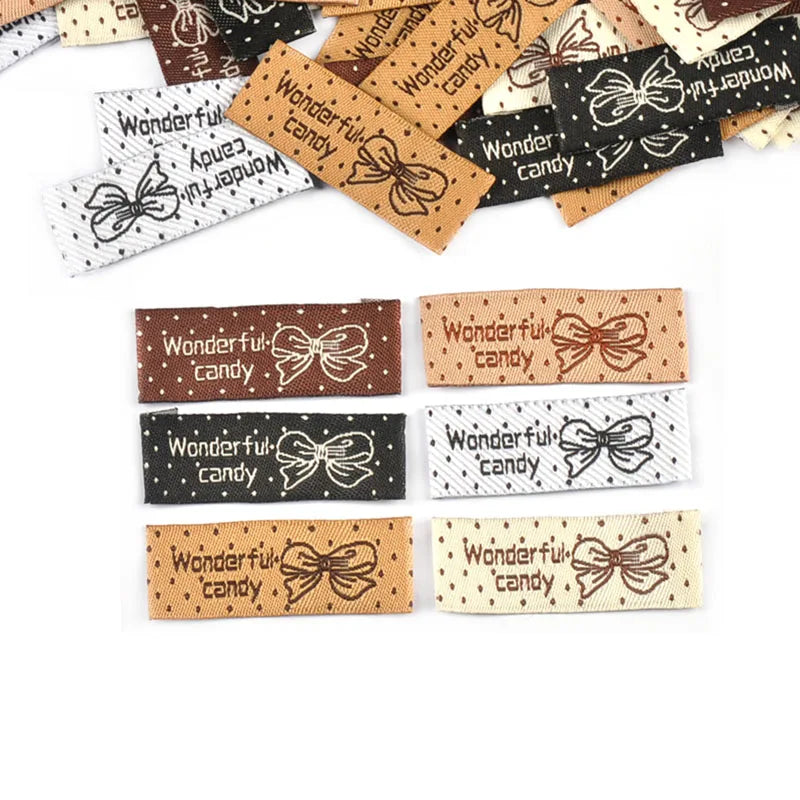 50pcs 41x15mm Mixed 6 Colors Rectangle Bow Dot Pattern Clothes Labels Sewing Supplies DIY Bags Shoes Hats Handmade Fabric c3783 Qme random mixed