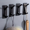 4 stainless steel non perforated wall mounted hooks for household use Qme black
