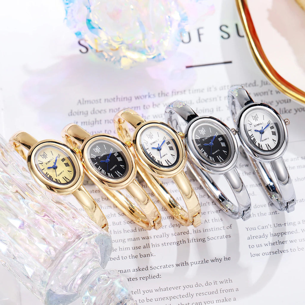 Diamond studded bathtub bracelet women's watch women's watch fashion oval Roman scale women's watch quartz watch Qme