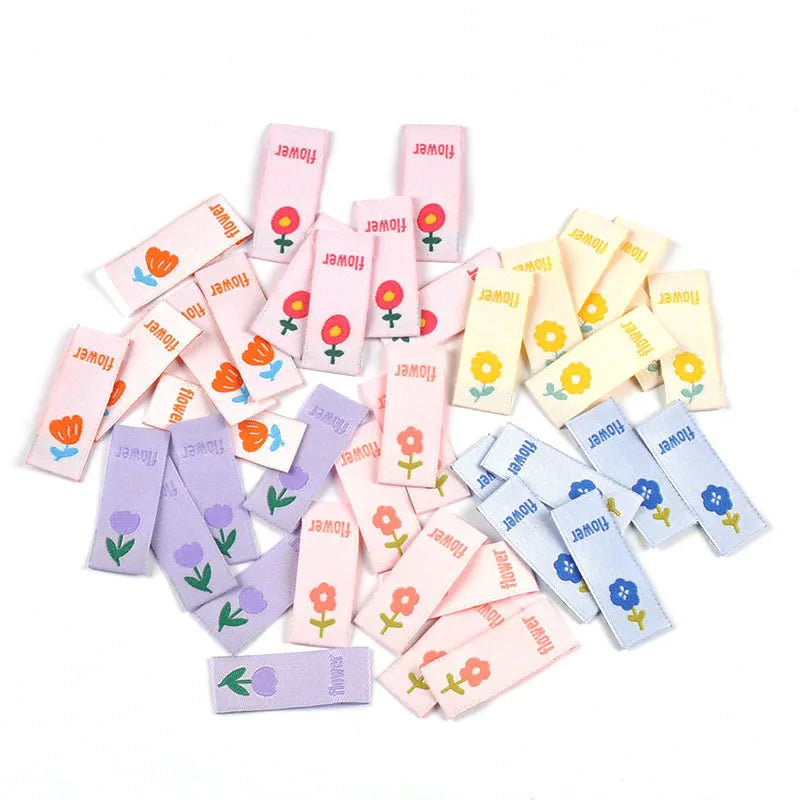 50pcs Cute Flower Embroidery Labels DIY Garment Accessories Handmade Clothing Bag Shoes Tags Kids Sewing Crafts 41x15mm c3630 Qme